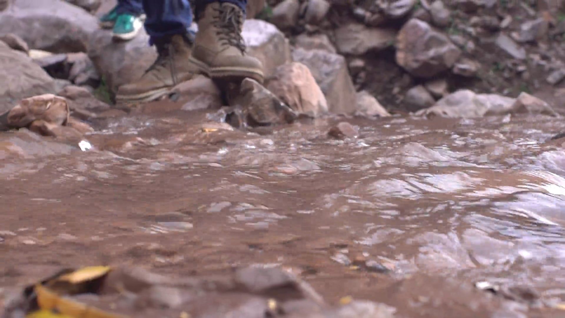 Close-Up View of a Person Standing by the Brook Free Stock Video ...