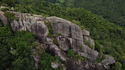 Drone Footage of a Person Standing on the Top of the Cliff