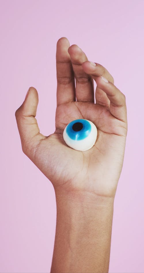 Person Holding a Toy Eyeball