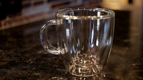 Pouring Tea into Glass Cup