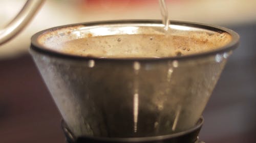 Pouring Hot Water on a Coffee Brewer