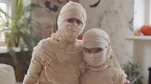 Kids Wearing Mummy Costumes For Halloween