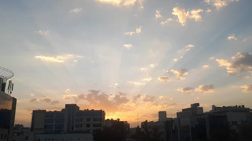 Silhouettes of City Buildings During Sunset