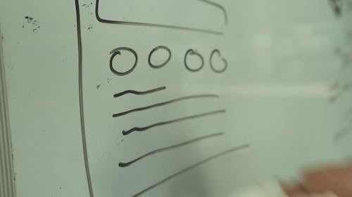 A Person Drawing on a Whiteboard