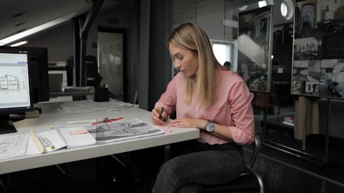 Woman Writing on Sticky Notes