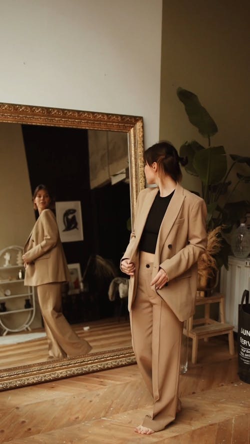 Girl in New Suit Checking out in Mirror