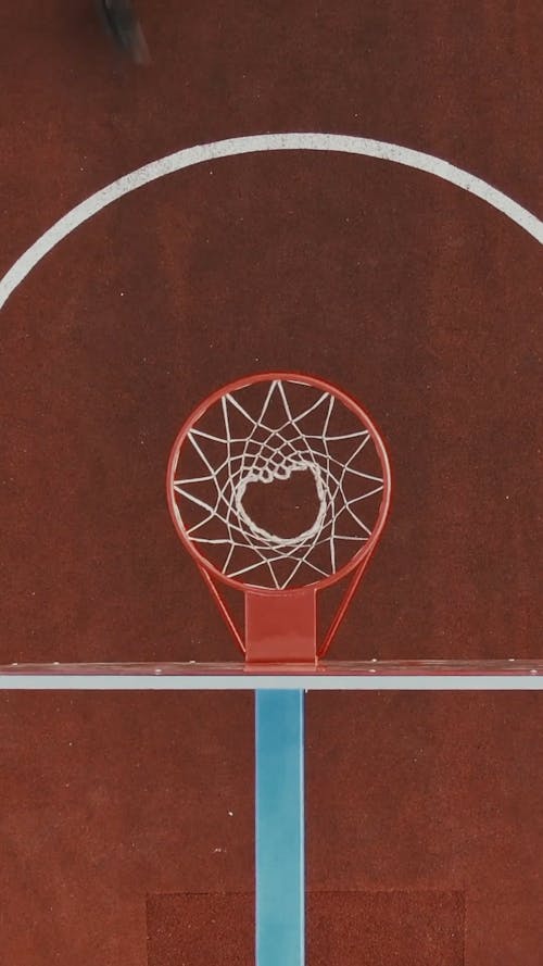 Top View of a Man Dunking the Basketball