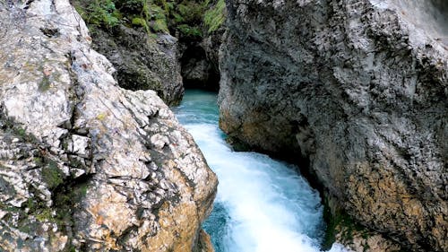 A River Flowing Between Natural Rock Formations