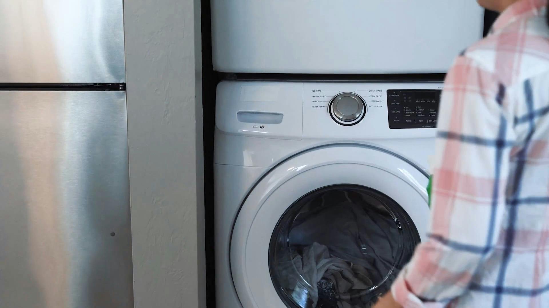 Woman Pouring Laundry Soap on a Washing Machine · Free Stock Video