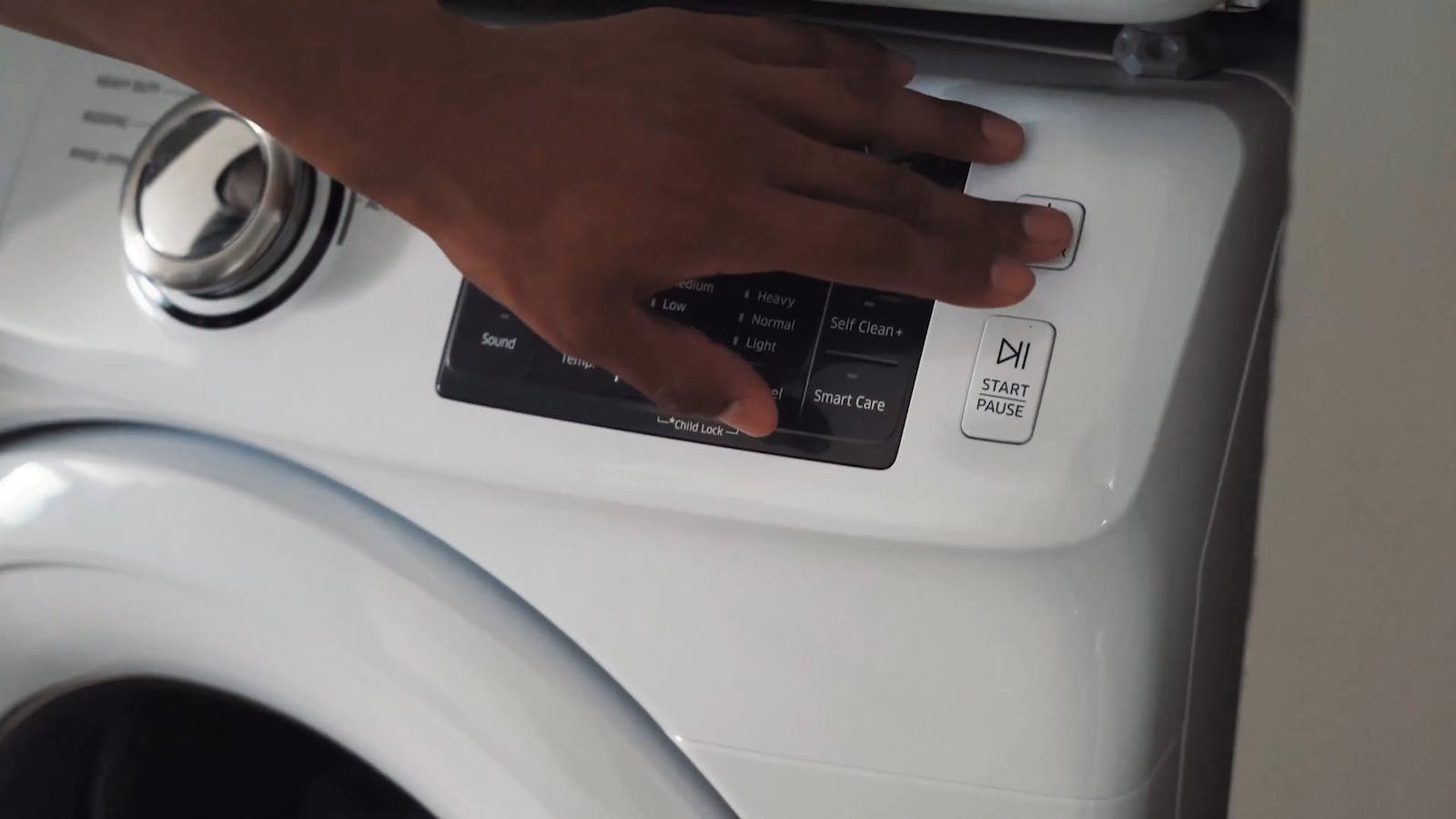 A Man and Woman Talking While Leaning on a Washing Machine Free Stock ...