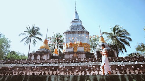 Buddhist Woman Doing a Ritual Outdoors