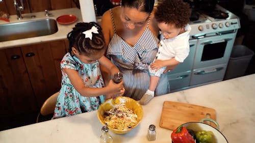 A Mother Preparing Food with Her Kids