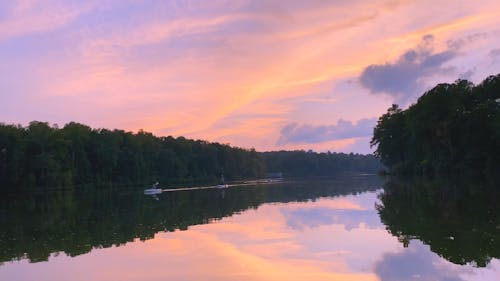 People Rowing Boats at a Beautiful Lake