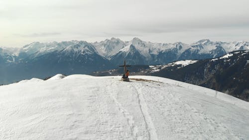 Drone Footage of a Cross on a Mountain Peak