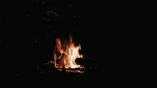 A Bonfire Burning Against Dark Background