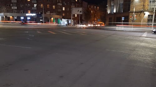 Time-Lapse Video of Light Trails Passing by the Road