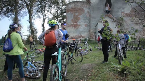 Cyclists Arriving at Church of St Maria Magdalena in Vovkiv Ukraine 
