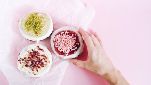 Person Taking a Cronut Out of the Flat Lay