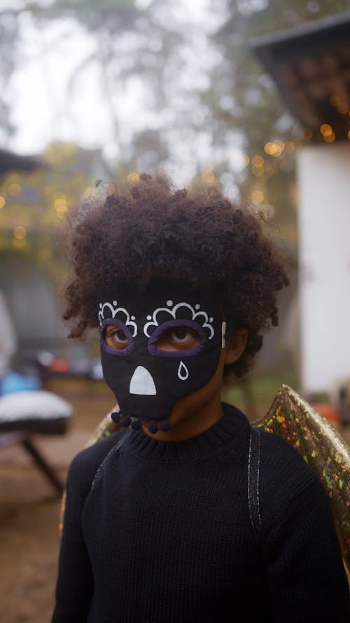 A Kid Disguised in Halloween Costume