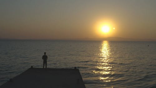 Drone Flying Over The Sea From A Jetty