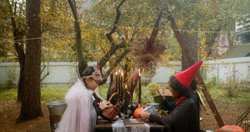 Kids in Halloween Costumes in the Garden