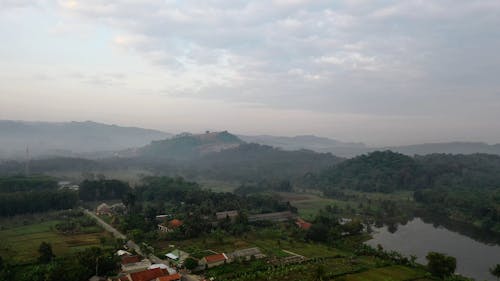 Drone Footage of Agricultural Lands and Mountains