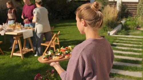 Beautiful Woman Getting Meal for the Family Gathering