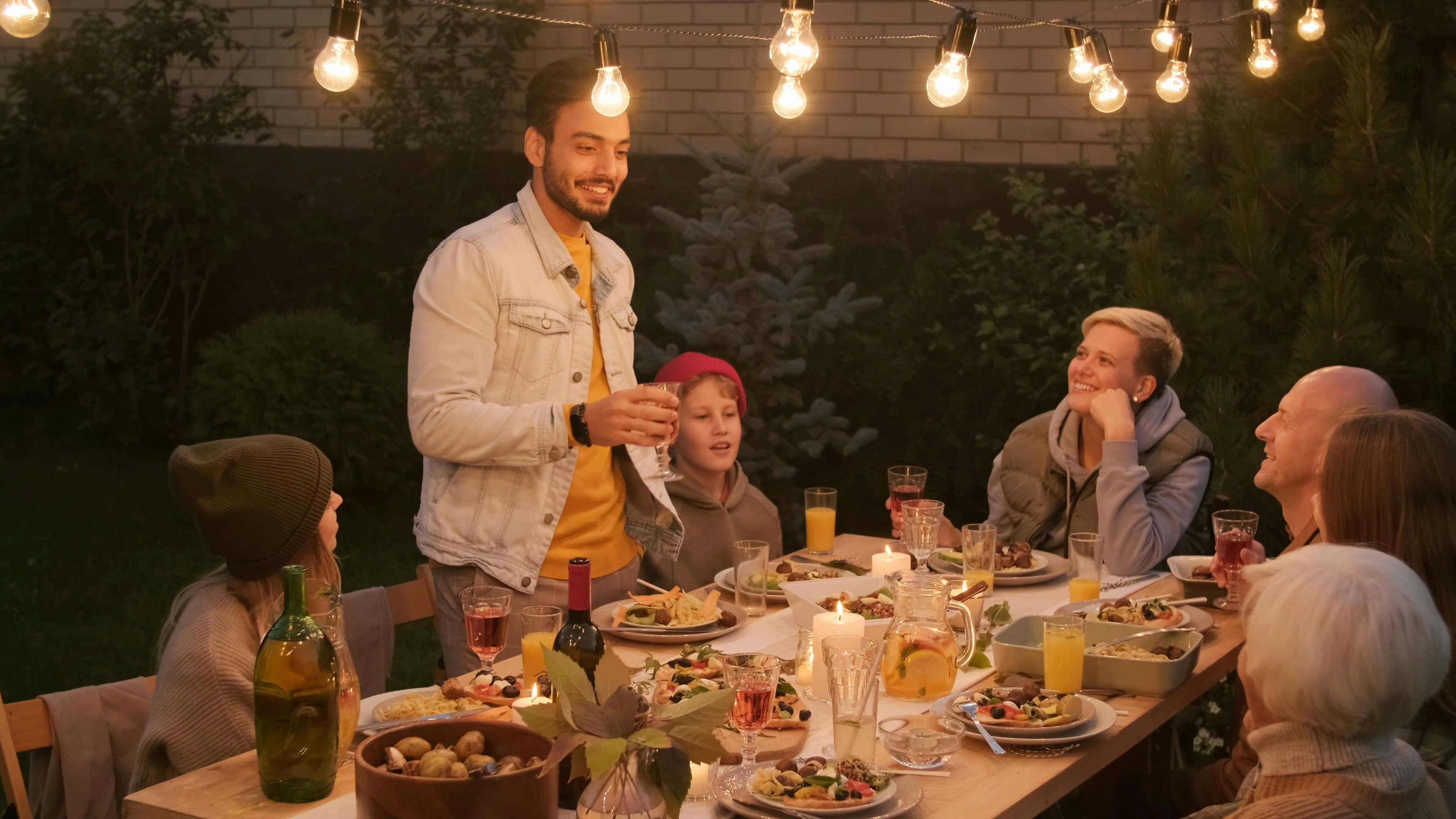 Man Talking In Front of a Food Gathering · Free Stock Video