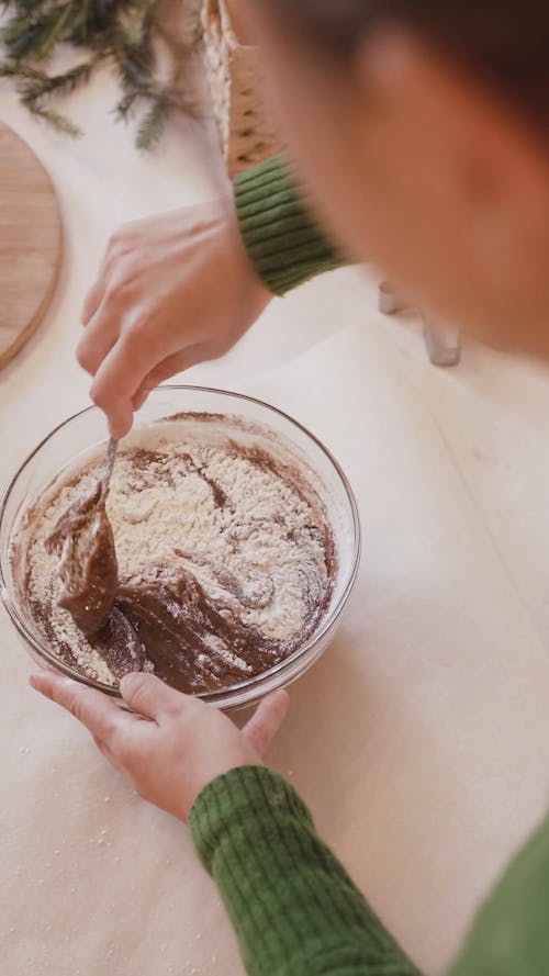 A Girl Mixing A Chocolate Batter