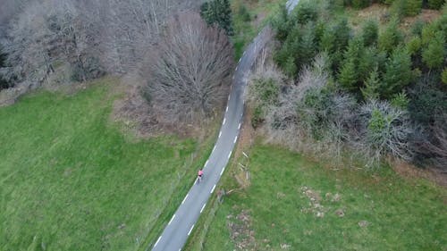 Drone Footage of a Person Riding a Bike