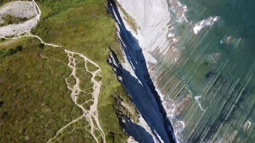 Drone Footage Of A Cliff Coastline Above The Sea Water