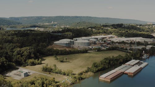 Drone Footage of an Industrial Plant near a Body of Water