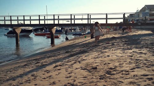 Girl Running In The Beach Sand