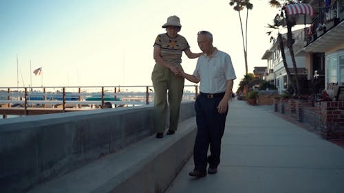 Elderly Couple Walking on the Bayside