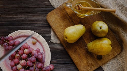 A Person Slicing a Pear