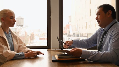 A Businessman Talking to His Client