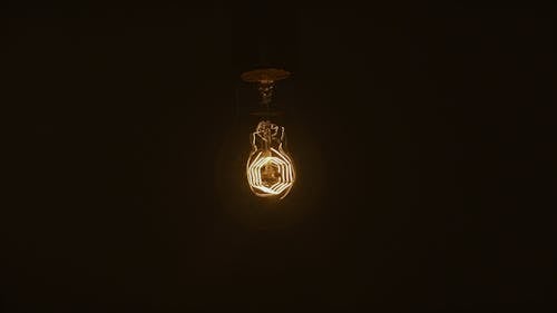 The Glowing  Filament Of An Incandescent Bulb