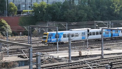 A Train Moving in Railway Tracks