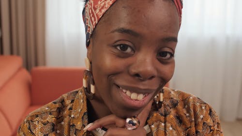 Close-Up View of a Woman Smiling While Looking at the Camera