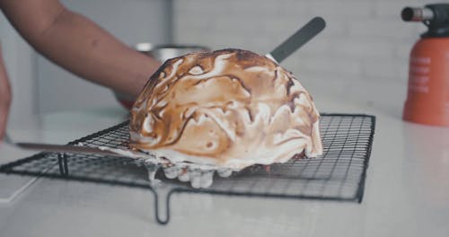 Chef Plating A Roasted Cake