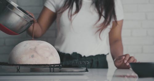 Person Pouring Chocolate