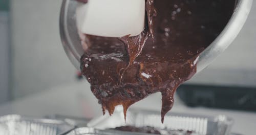 Putting A Chocolate Mixture On A Baking Tray