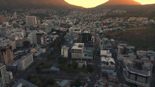 Drone Footage of Cityscape During Sunset