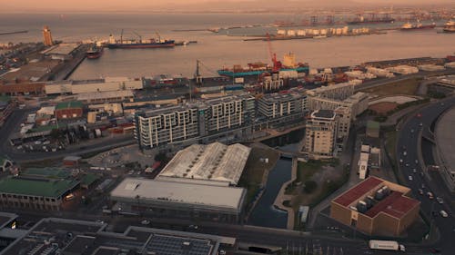 Drone Footage of City Buildings During Sunset