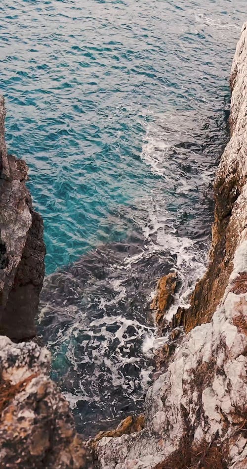 Waves Crashing The Cliff Coast