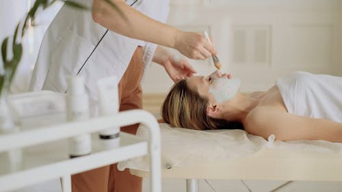 A Woman Getting a Facial Treatment