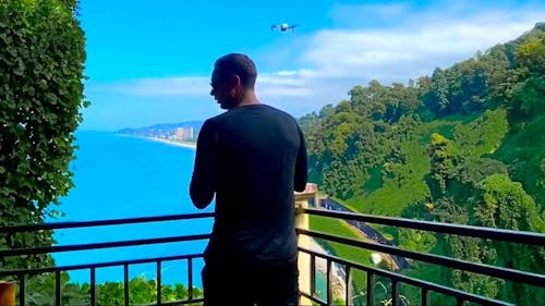 Man Flying a Drone From his Terrace