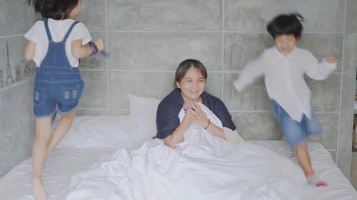 Children Running on the Bed