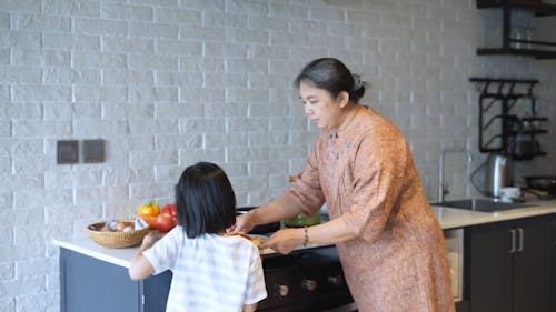 Woman Serving Spaghetti on the Table