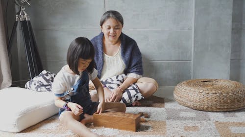 A Girl Fixing Her Toys